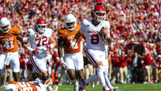 Oklahoma Sooners QB Dillon Gabriel runs for a touchdown against the Texas Longhorns.